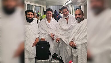 From left, Misbah-ul-Haq, Fakhr-e-Alam, Wasim Akram and Arsalan H Shah pose in white Ihram garments before departing for Haj in Saudi Arabia.