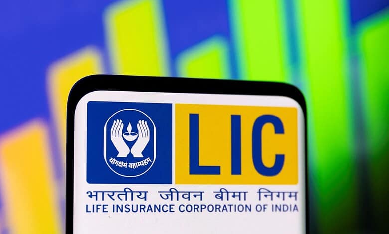 LIC logo displayed on a digital screen with colourful financial graphs in the background.