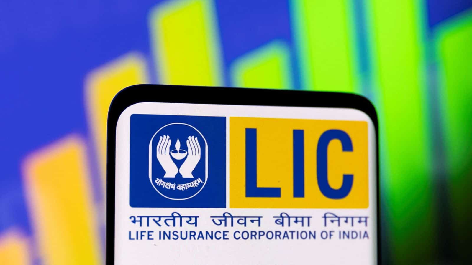 LIC logo displayed on a digital screen with colourful financial graphs in the background.
