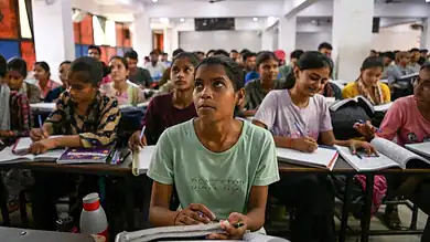 Students sitting in exam hall during NEET UG re-test in Hyderabad.