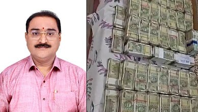Official from Telangana ACB with seized cash and assets from Land Survey official.