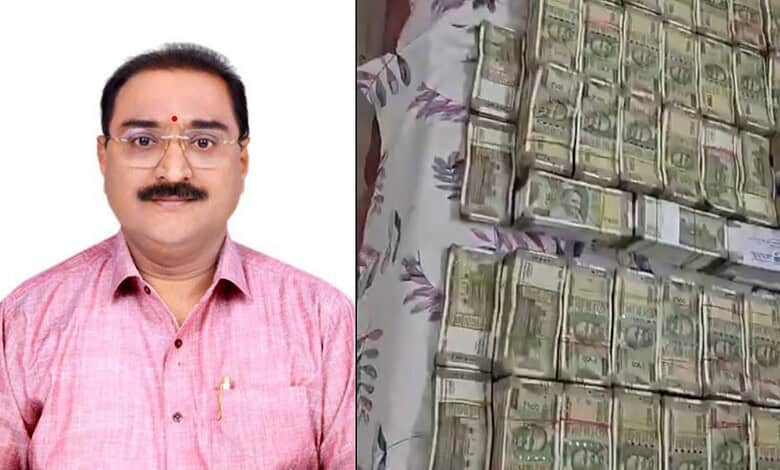 Official from Telangana ACB with seized cash and assets from Land Survey official.