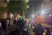 Crowd gathers outside bank after ATM catches fire due to short circuit in Hyderabad.