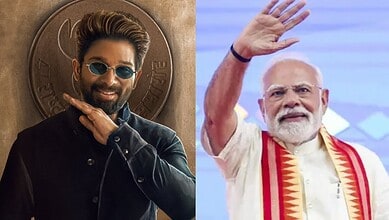 Indian Prime Minister Narendra Modi waving at the crowd during a public event.