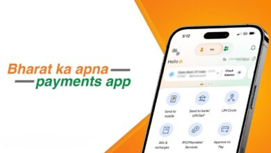 Smartphone displaying BHIM payments app interface with India map and digital payment options.