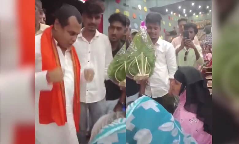 Celebration event at The Siasat Daily with people exchanging gifts and enjoying festivities.