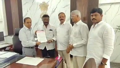 Group of officials during a formal meeting in Telangana, discussing election issues.
