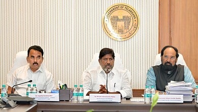 Telangana government officials at a meeting discussing tourism and revenue growth.