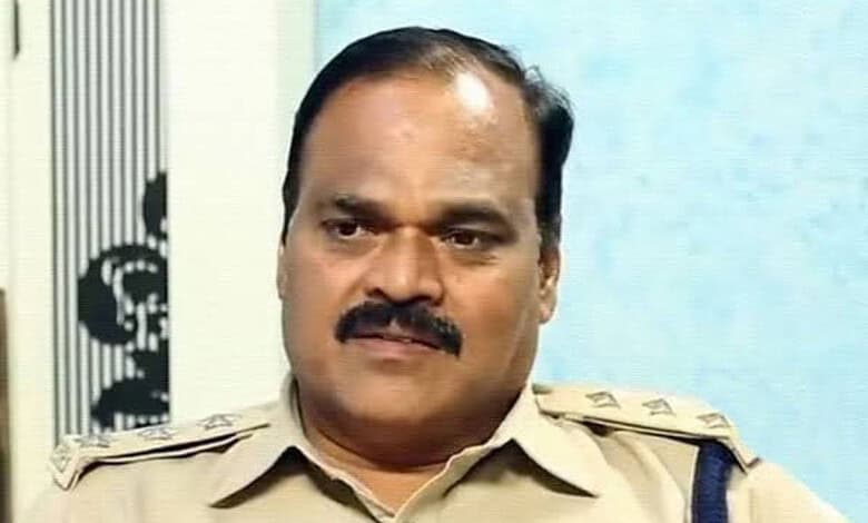 A police officer in uniform speaking during an interview or press conference.