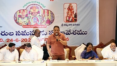 Officials and speakers at a cultural event celebrating Bonalu festival in Hyderabad.