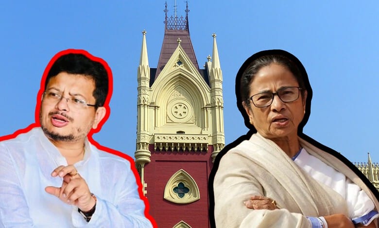Calcutta High Court building with two women in front, one gesturing, in front of a clear blue sky.