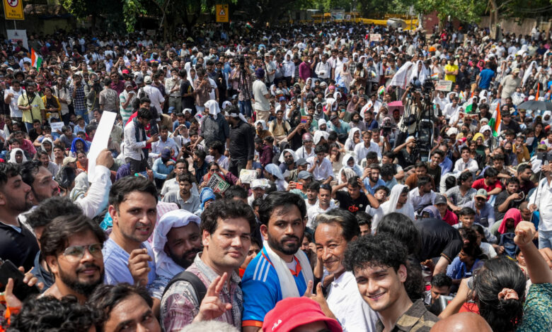Cockroach Janta Party (CJP) founder Abhijeet Dipke, in blue, its spokespersons Saurav Das and Vijeta Dahiya, and Climate activist Sonam Wangchuk during a protest