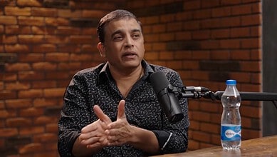 Indian film director and producer Dil Raju speaking during an interview.
