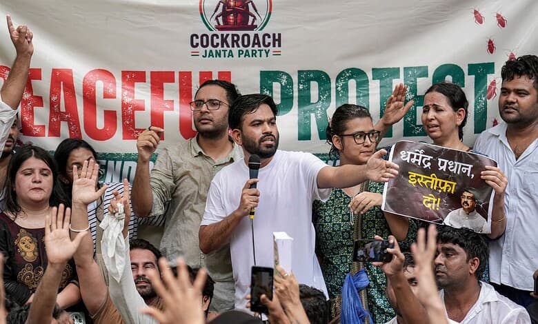 Group of protesters holding signs and raising hands during a peaceful protest against cockroach Janta Par.