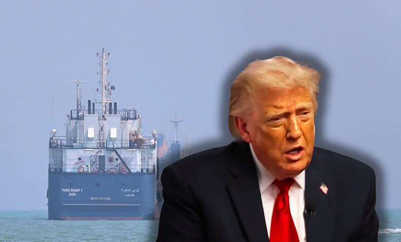 A man resembling Donald Trump speaking with a large ship in the background on the sea.