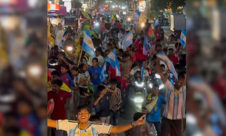 Crowd of football fans celebrating on the streets during FIFA World Cup in Sainikpuri.