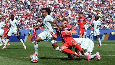 FIFA World Cup match with players competing fiercely on the field.