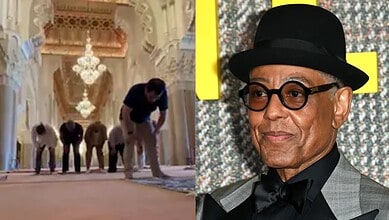 Giancarlo Esposito wearing a black hat and glasses at an event.