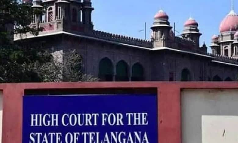 Telangana High Court building with historic architecture and domes, sign visible in the foreground.