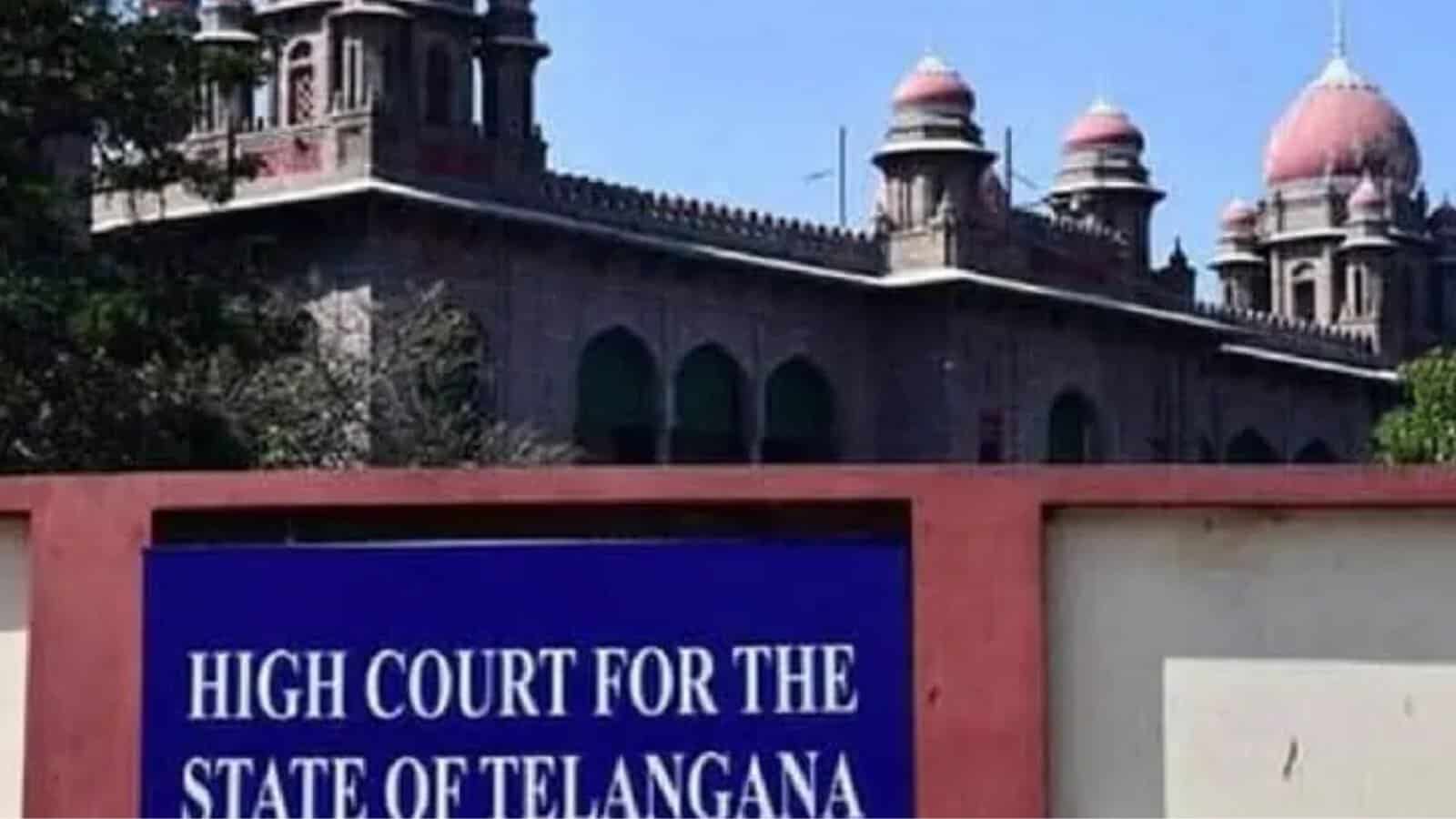 Telangana High Court building with historic architecture and domes, sign visible in the foreground.
