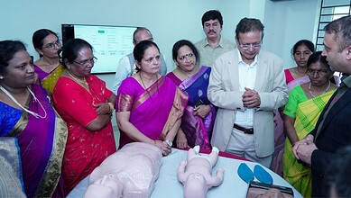 Telangana nurses and officials observe a medical simulation training session with mannequins.
