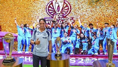 The Siasat Daily, women's cricket team celebrating victory with trophies and confetti.