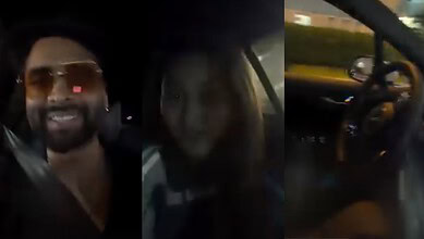 Man and woman smiling inside a car during night drive.