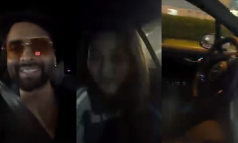 Man and woman smiling inside a car during night drive.