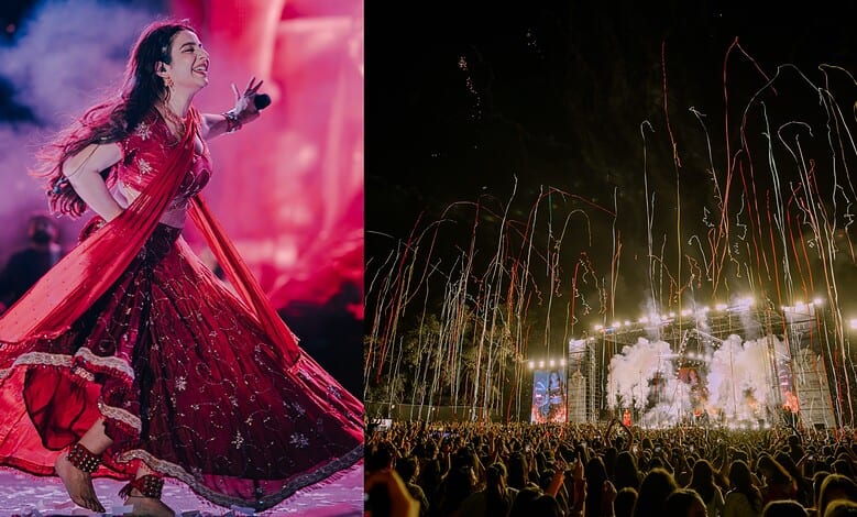 Jasmine Sandlas performing on stage at Hyderabad concert with fireworks in background.
