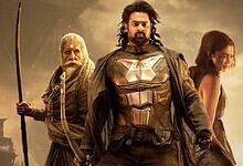 A fierce group of characters from a superhero or fantasy film standing together against a dramatic, storm.