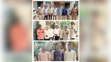 Police officers with detained individuals in Kamareddy, Telangana, India.