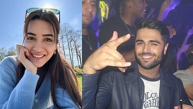 Kriti Sanon's boyfriend seen with another girl at a social event, smiling and making a hand gesture.