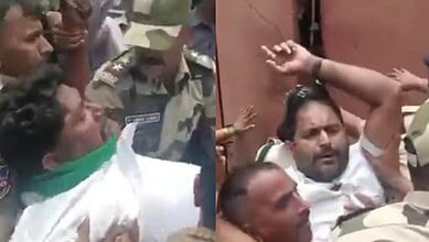 Protesters clash with police during Lambada protest at Gandhi Bhavan in Hyderabad.