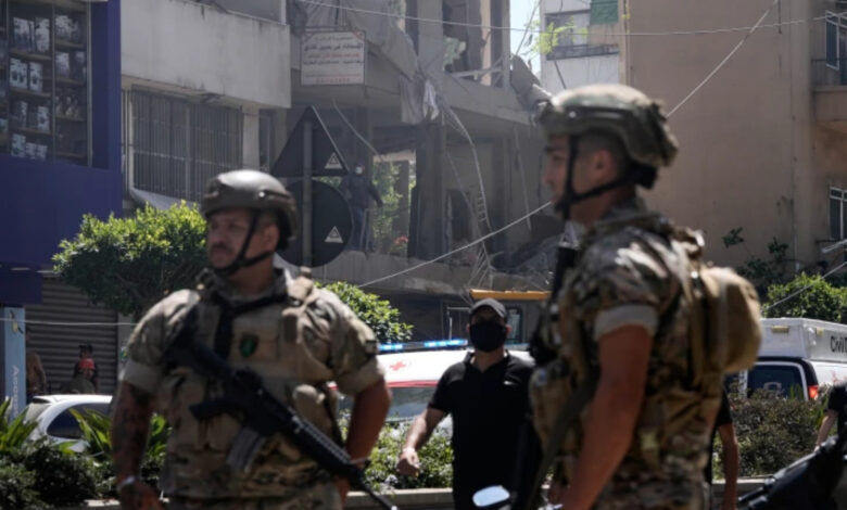 Lebanese soldiers stand guard at the site of an Israeli airstrike that struck an apartment in Dahiyeh, Beirut's southern suburbs in Lebanon