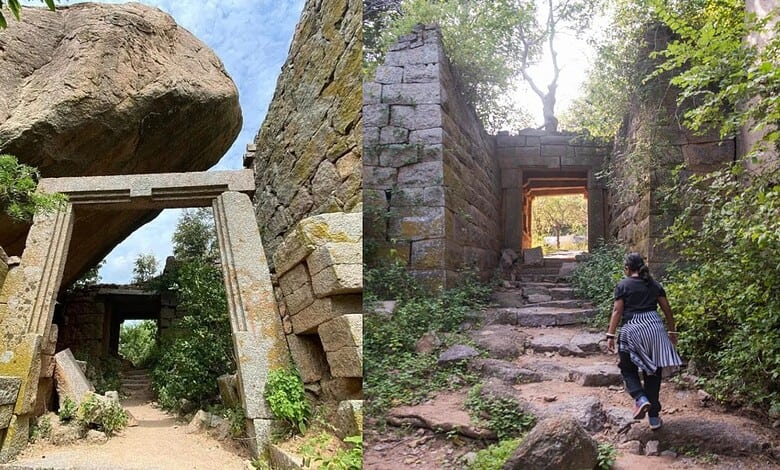 Ancient stone ruins and steps at a historic fort near Hyderabad, surrounded by greenery.
