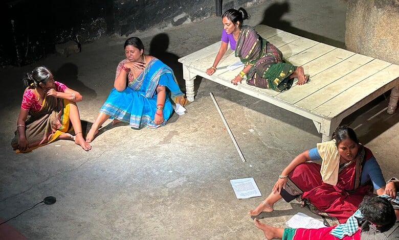 Women performing a traditional dance on stage during a cultural event in Hyderabad.