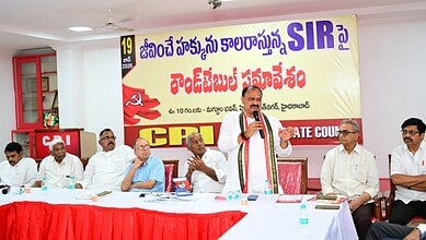 Telangana Congress chief addresses a press conference with party leaders at a meeting in Telangana.