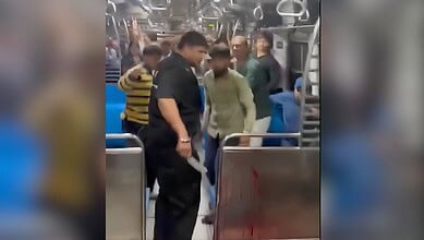 Passengers involved in a fight on a Mumbai local train over door opening issues.