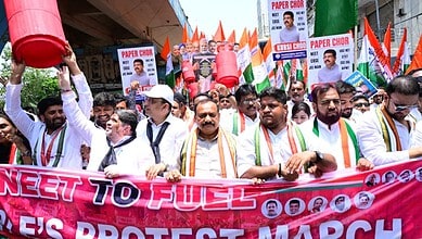 Protest rally with Indian political leaders holding banners and flags during a public demonstration in In.