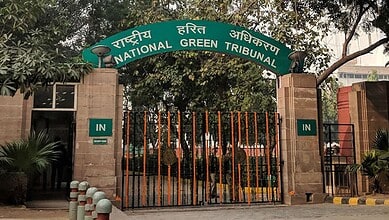 Entrance gate of the National Green Tribunal with signage in Hindi and English.