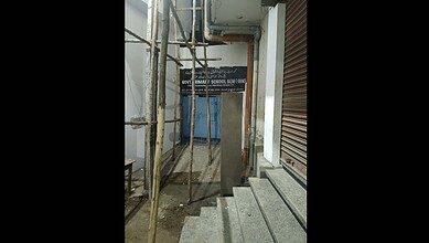 Construction site near Hyderabad school with scaffolding and stairs, safety concerns highlighted.