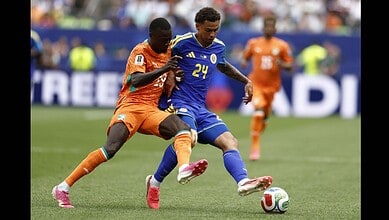 Ivory Coast and Curacao players jostle for the ball