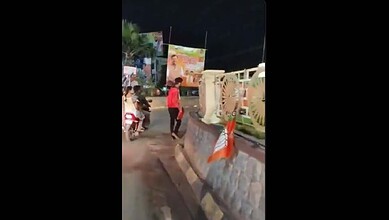 Man removes a BJP flag in Hanamkonda