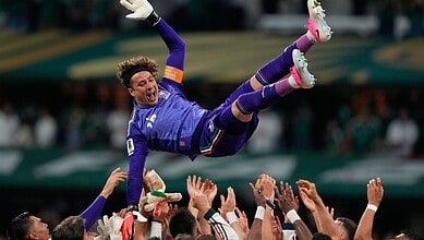 Ochoa celebrates with teammates after a historic match for Mexico.