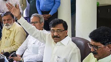 Maharashtra MP speaking at a press conference with media and officials present.