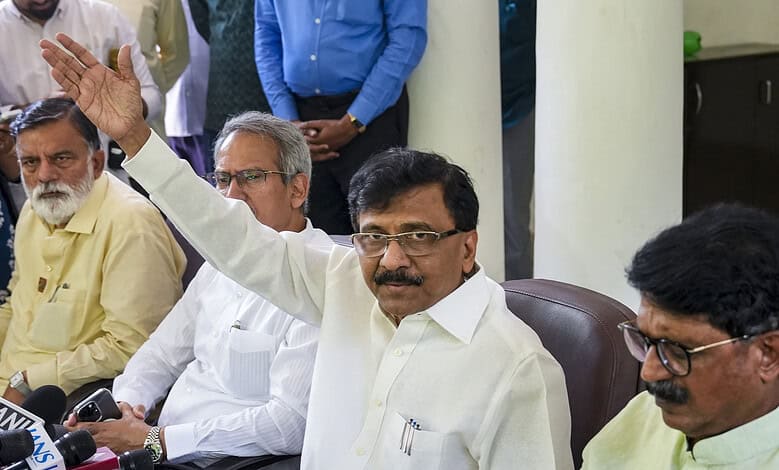 Maharashtra MP speaking at a press conference with media and officials present.