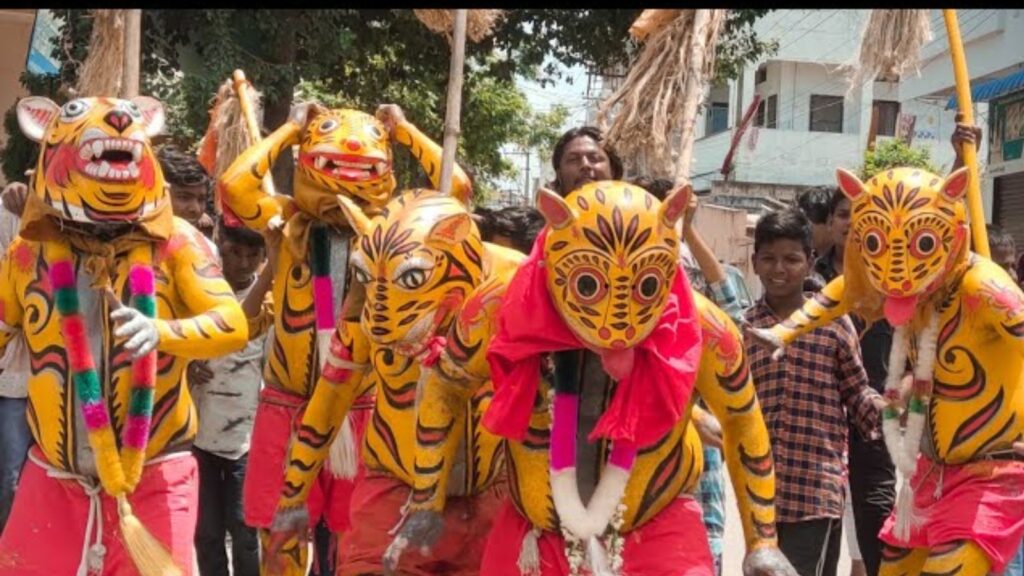 Men dressed as tigers perform in a traditional festival parade in India.