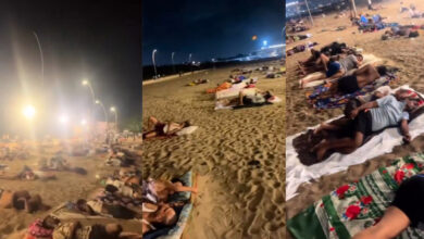 People sleeping on beach due to intense heat and power cuts in Mumbai