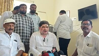 Ponnam Venkatesh speaking to media with colleagues in a room during a press event.