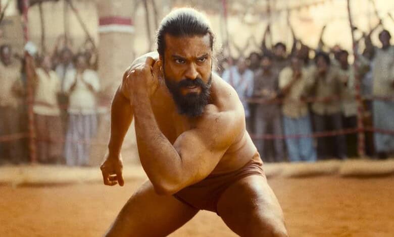 A man with a beard and long hair, dressed in traditional Indian attire, running in a historical or cultur.
